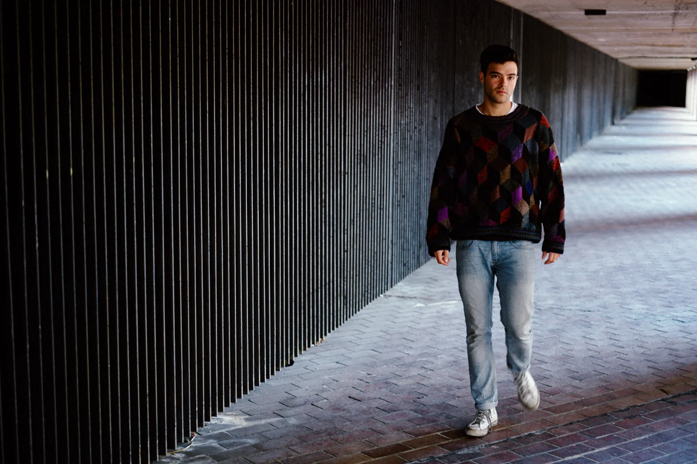 portrait photographer Tim Cole shoots man walking through under pass