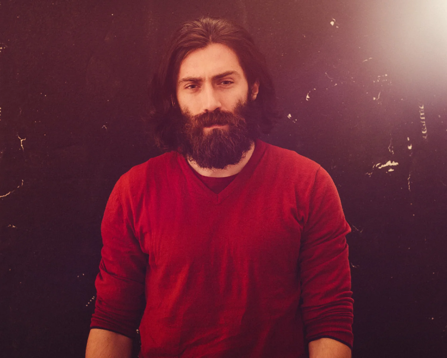 portrait photographer Tim Cole shoots man in red jumper
