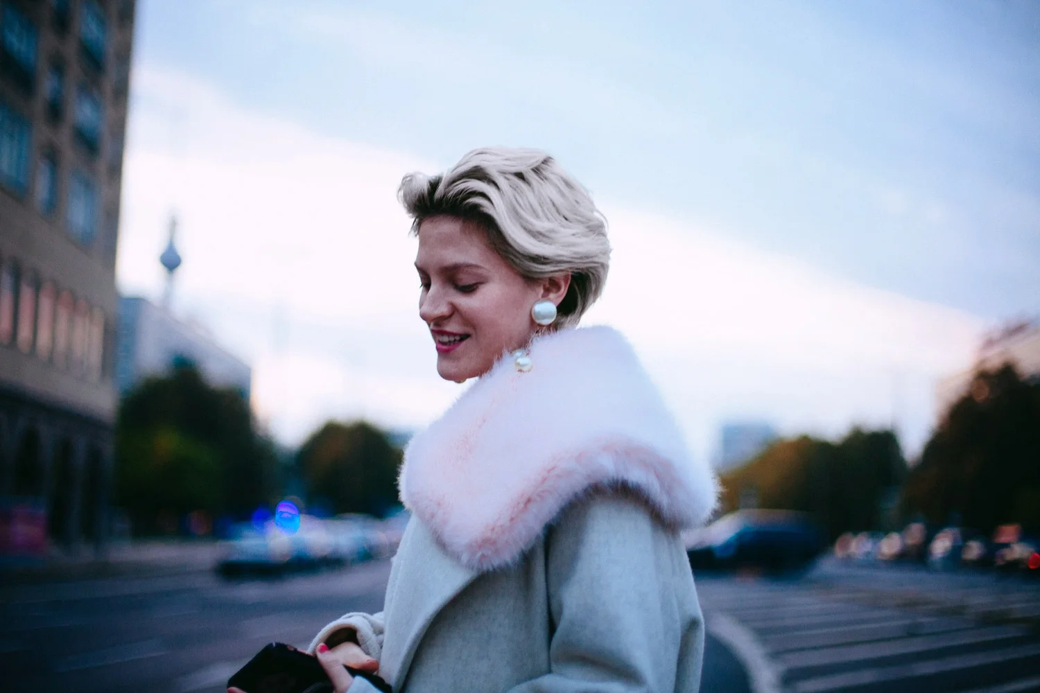Walking the streets of Berlin in a gifted coat. © Cherie Birkner