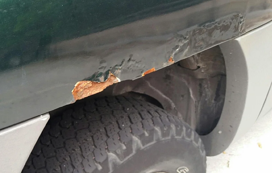 BEFORE (painted by the used car lot not 6 months before I took the pic)
