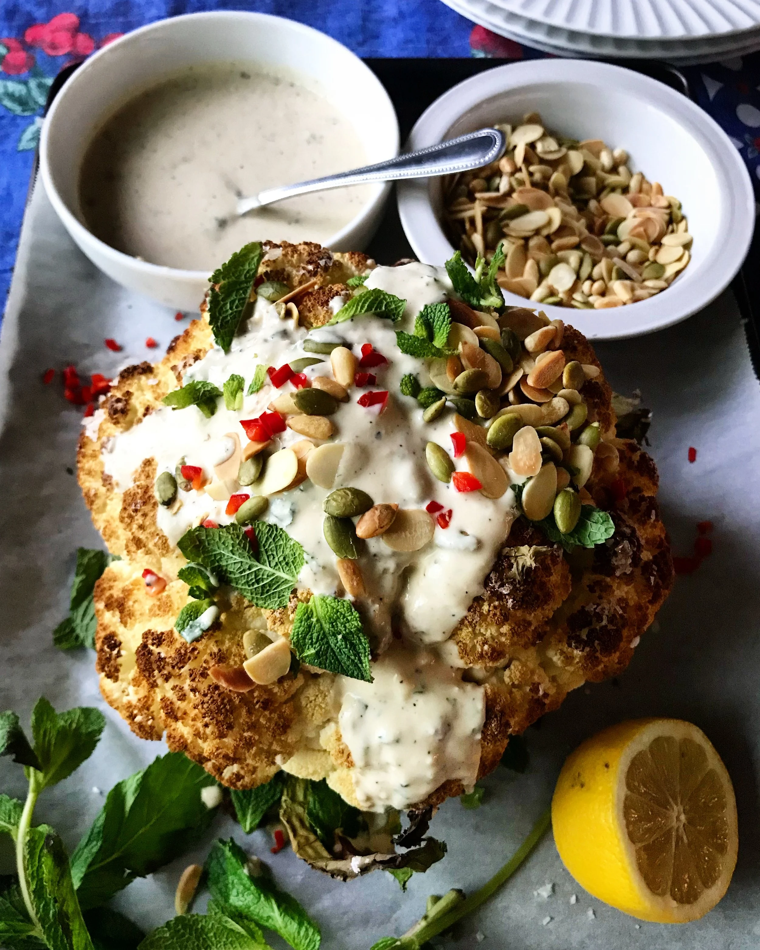 ROASTED CAULIFLOWER WITH TAHINI SAUCE, MINT AND NUTS