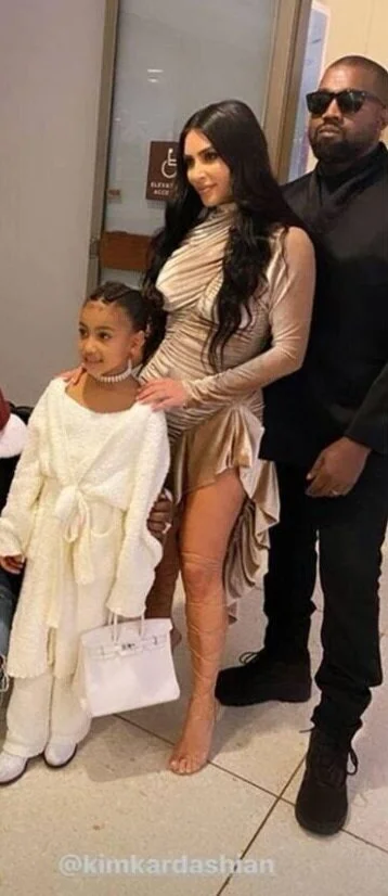 North West Carrying a Hermes Birkin Bag 25cm