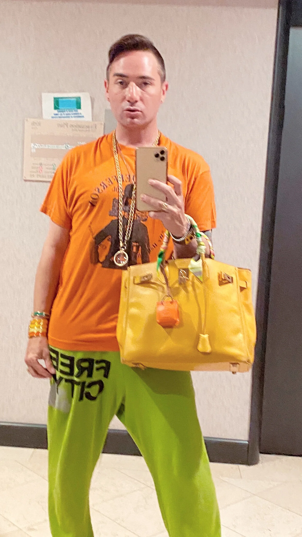 Michael Kuluva Wearing his Hermes Yellow Birkin Bag