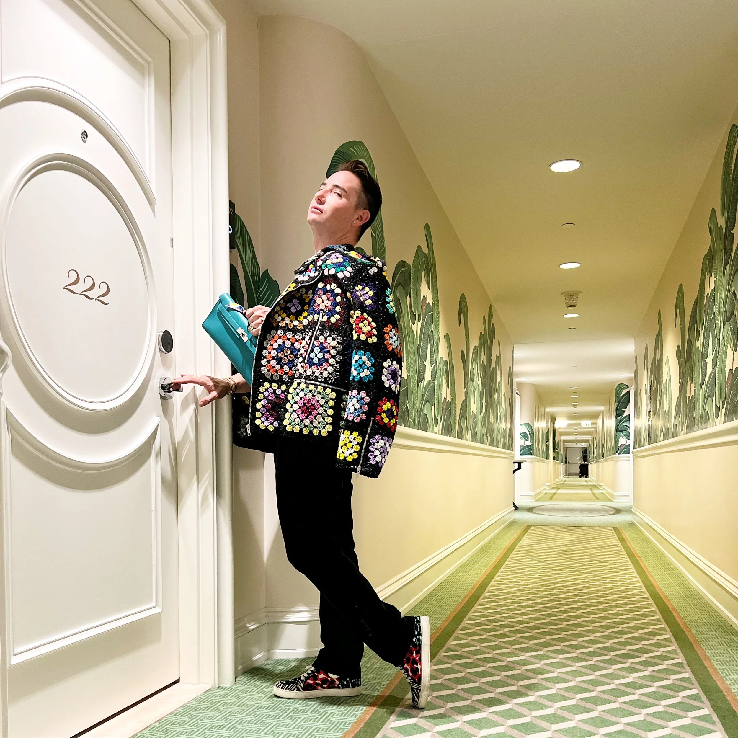 Michael Kuluva wearing his Hermes Kelly Cut Pochette