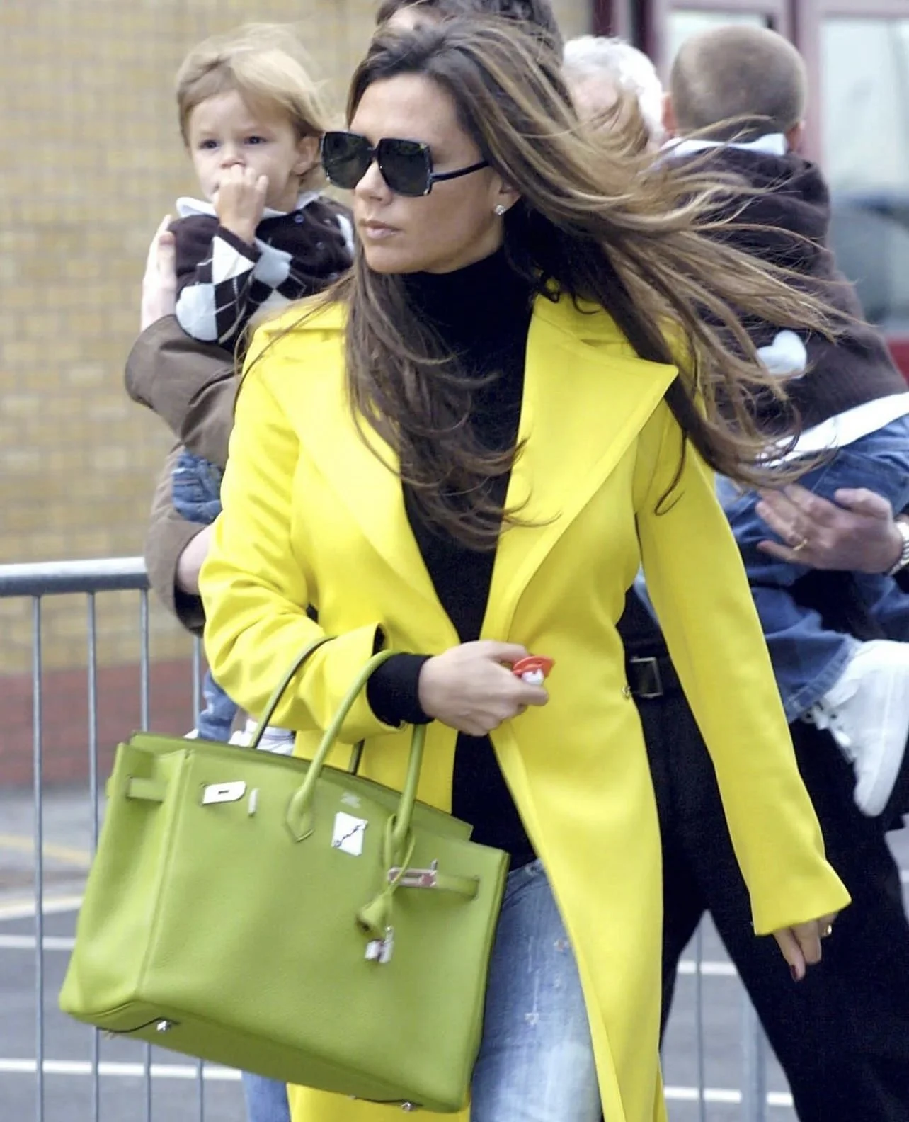Victoria Beckham with her Hermes Vert Anis Green Birkin Bag