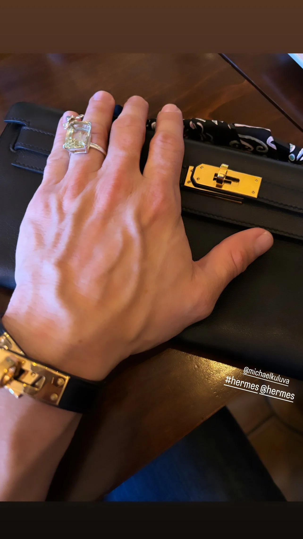 Michael KULUVA with his Hermes Kelly Cut Pochette