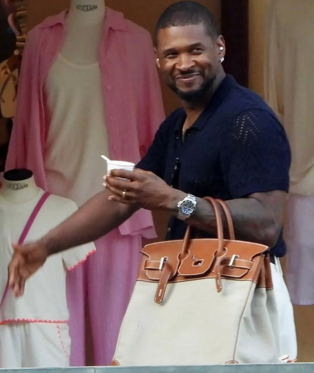 Usher with his Hermes HAC Birkin 