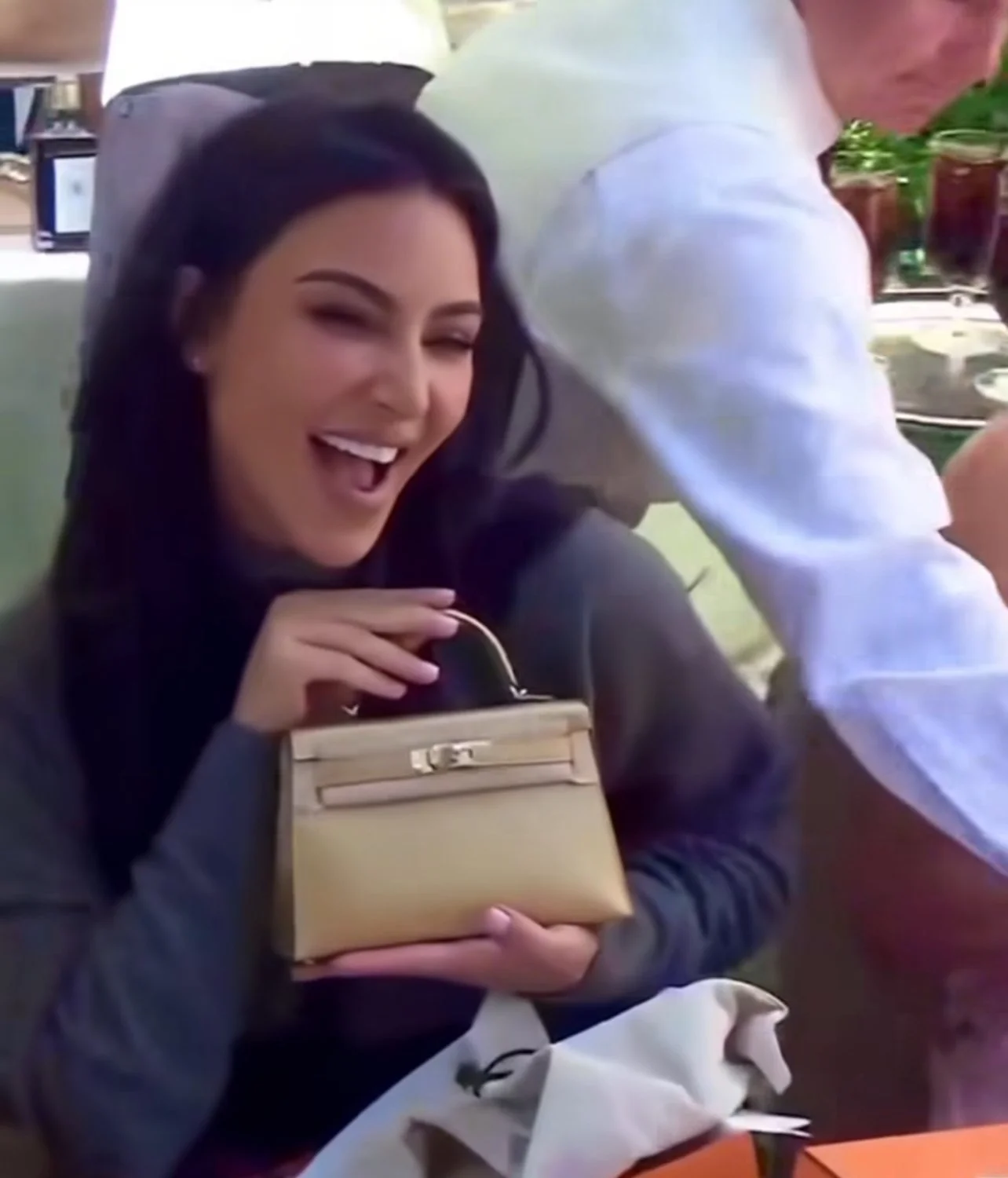 Kim Kardashian with her Rare Hermes Dore Mini Kelly 