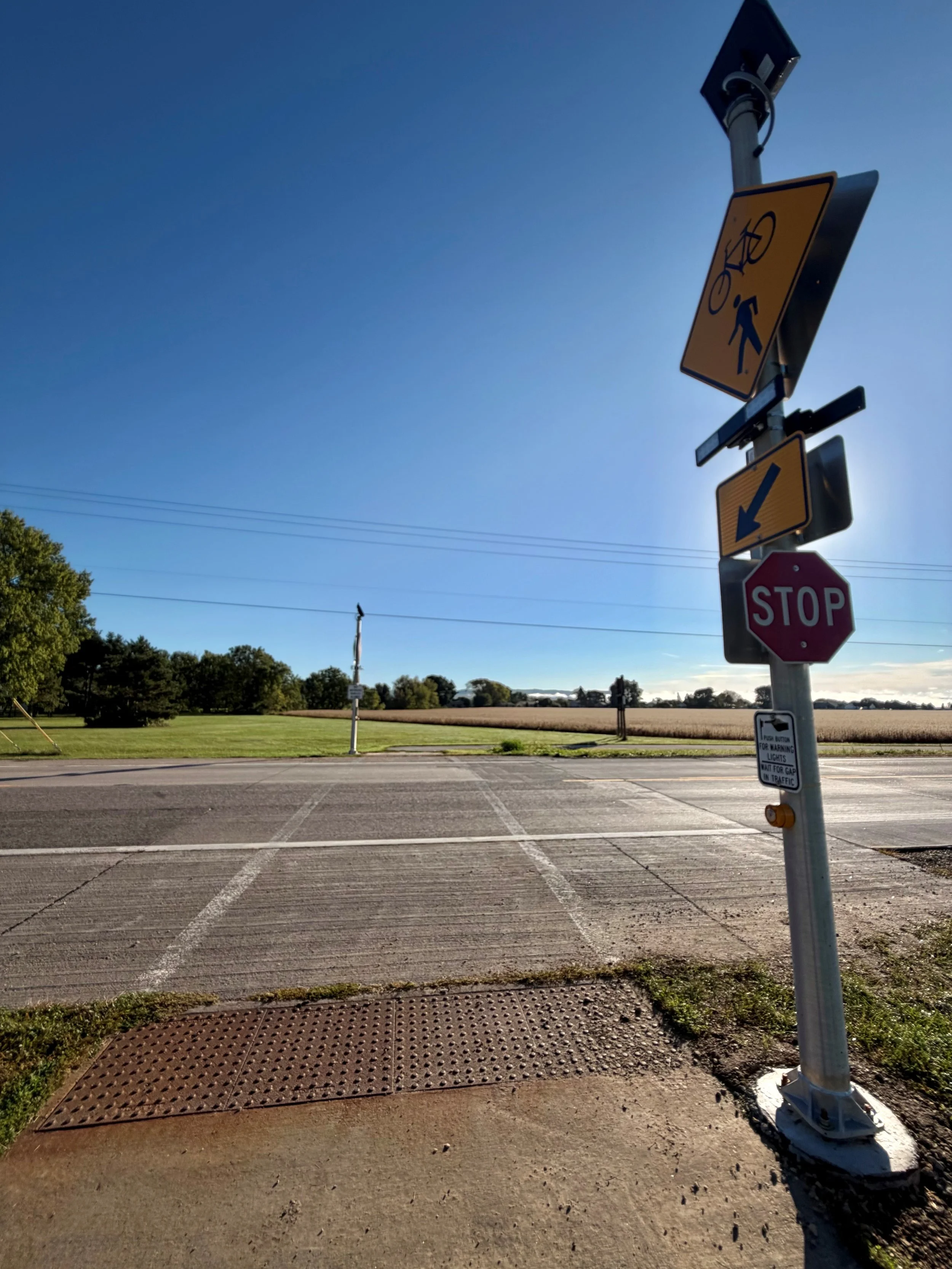 Rectangular Rapid Flashing Beacon at crosswalk to bike trail