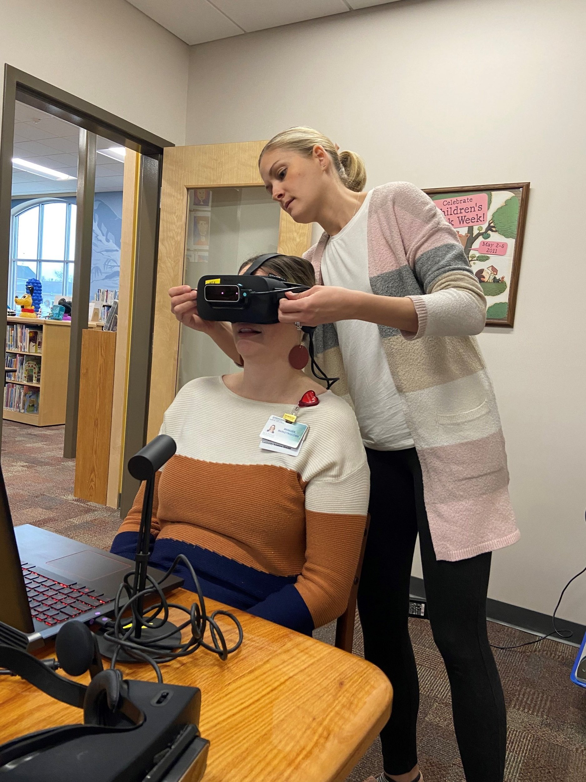 Maggie Sonnek being set up for virtual reality experience.jpg