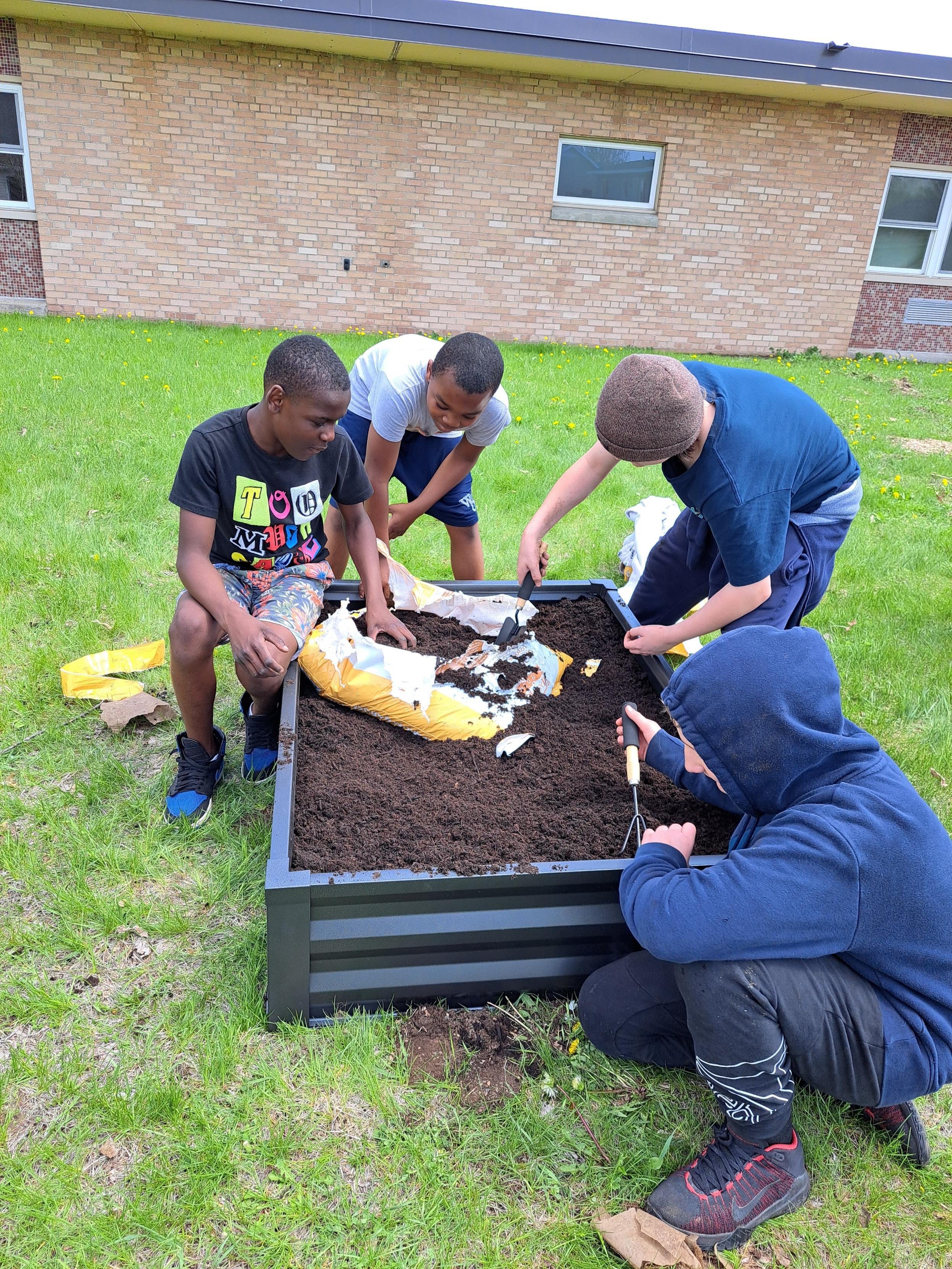 4 students preparing garden beds at SAIL.jpeg