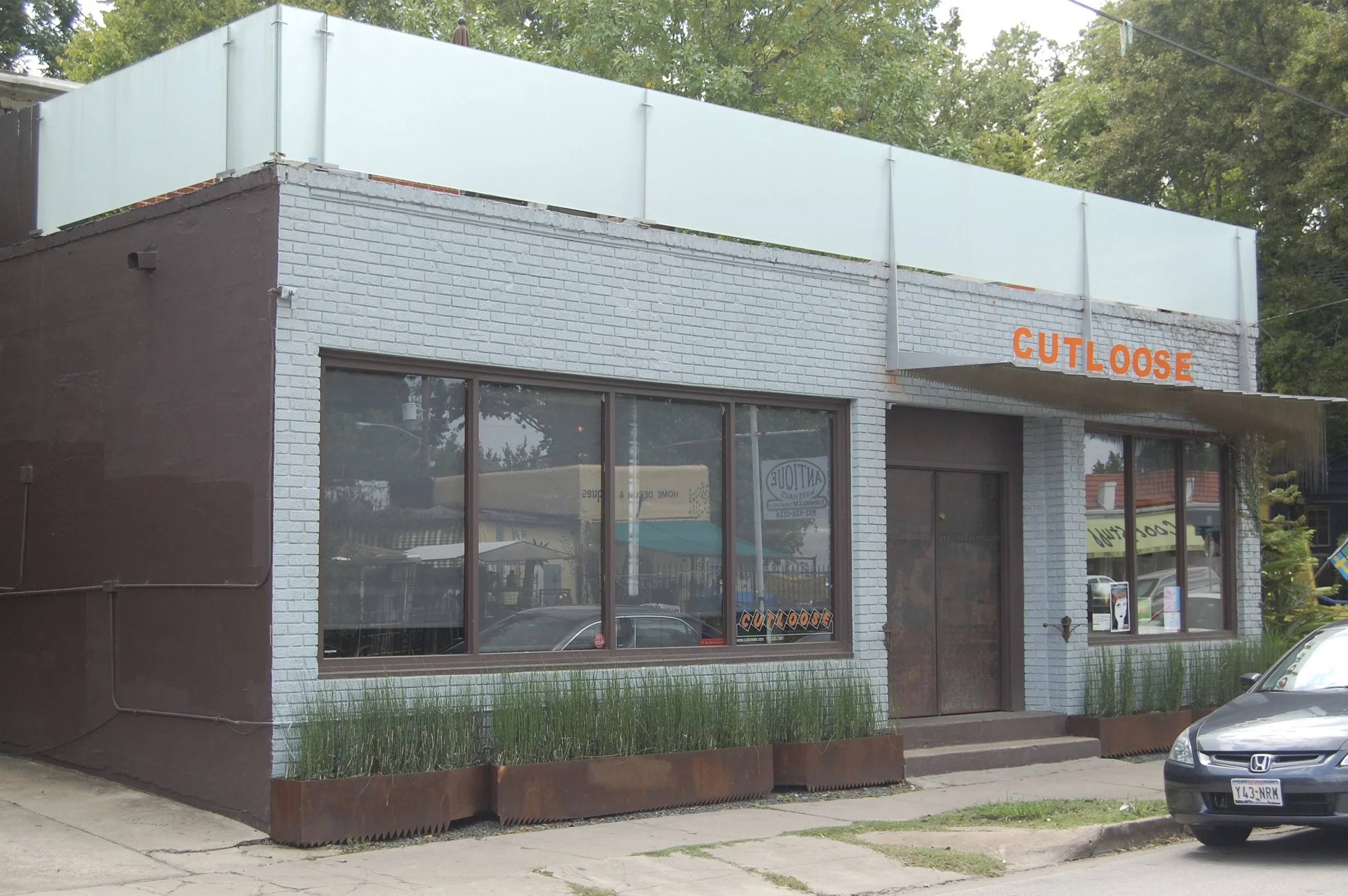 Cutloose signage and glass railing