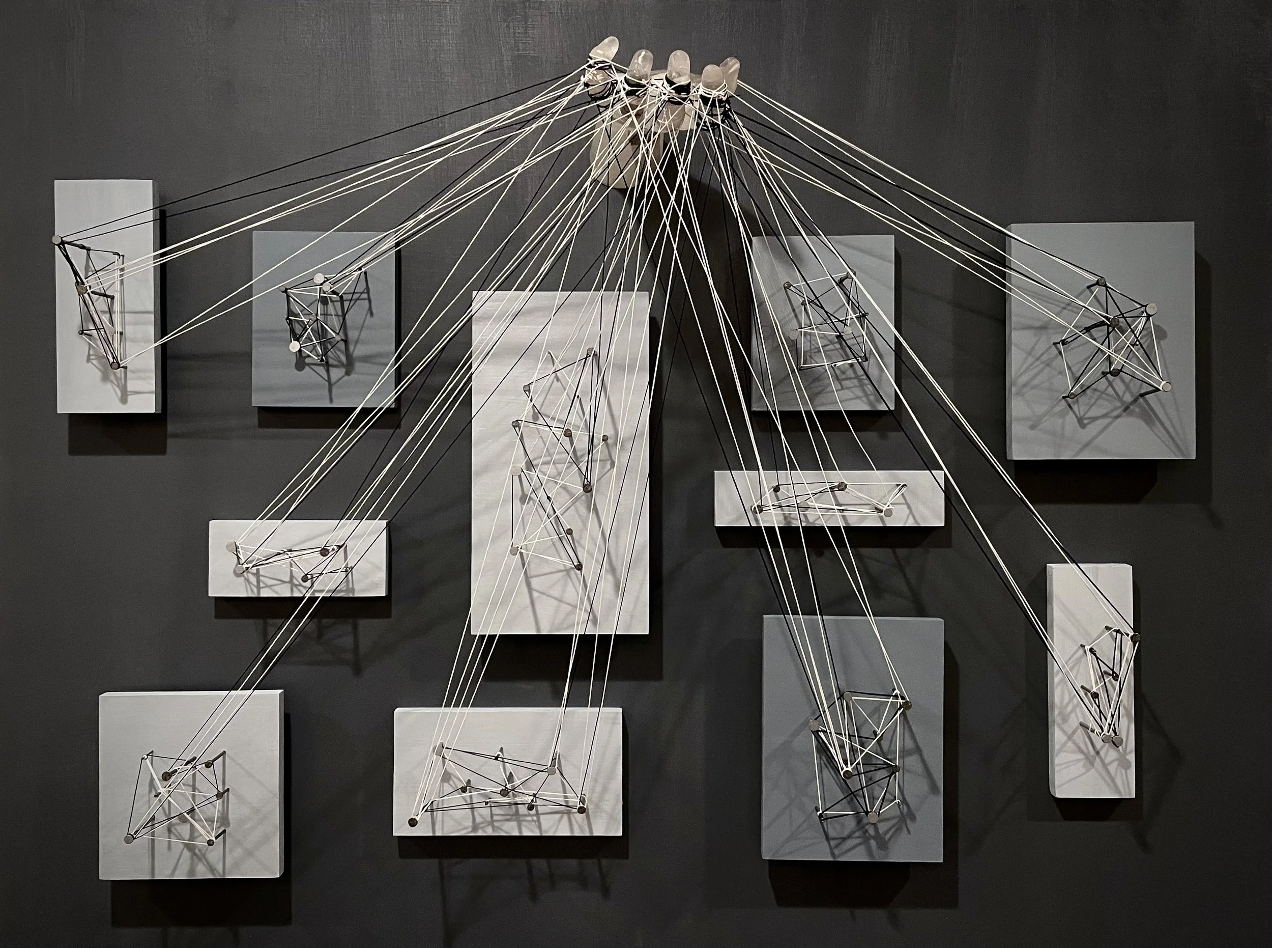  36x48” rice paper and resin hand, oil painted wood panels, various sized nails, with black and white strings 