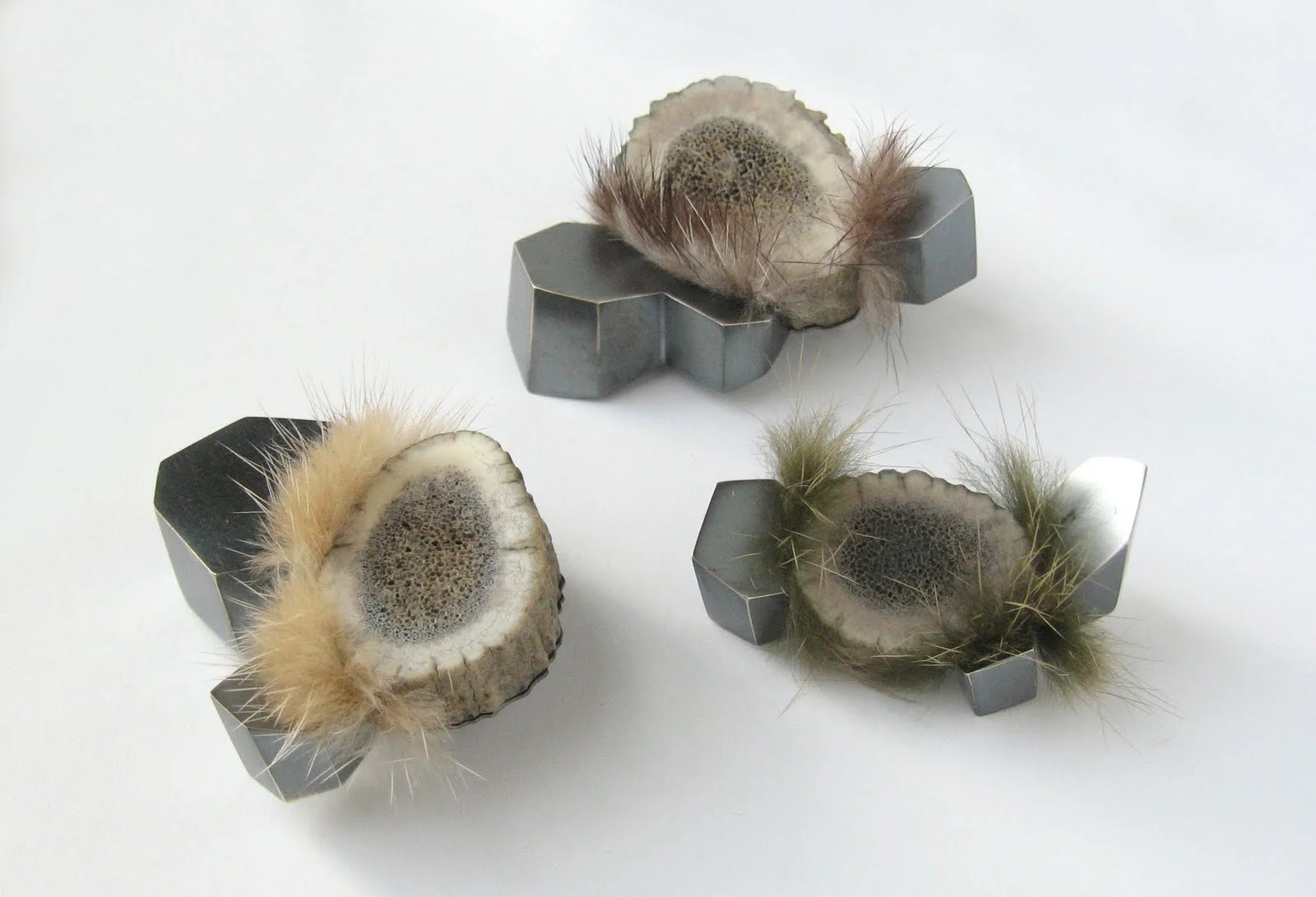 above: Antler/Mineral brooches , mule deer antler, sterling silver, mink