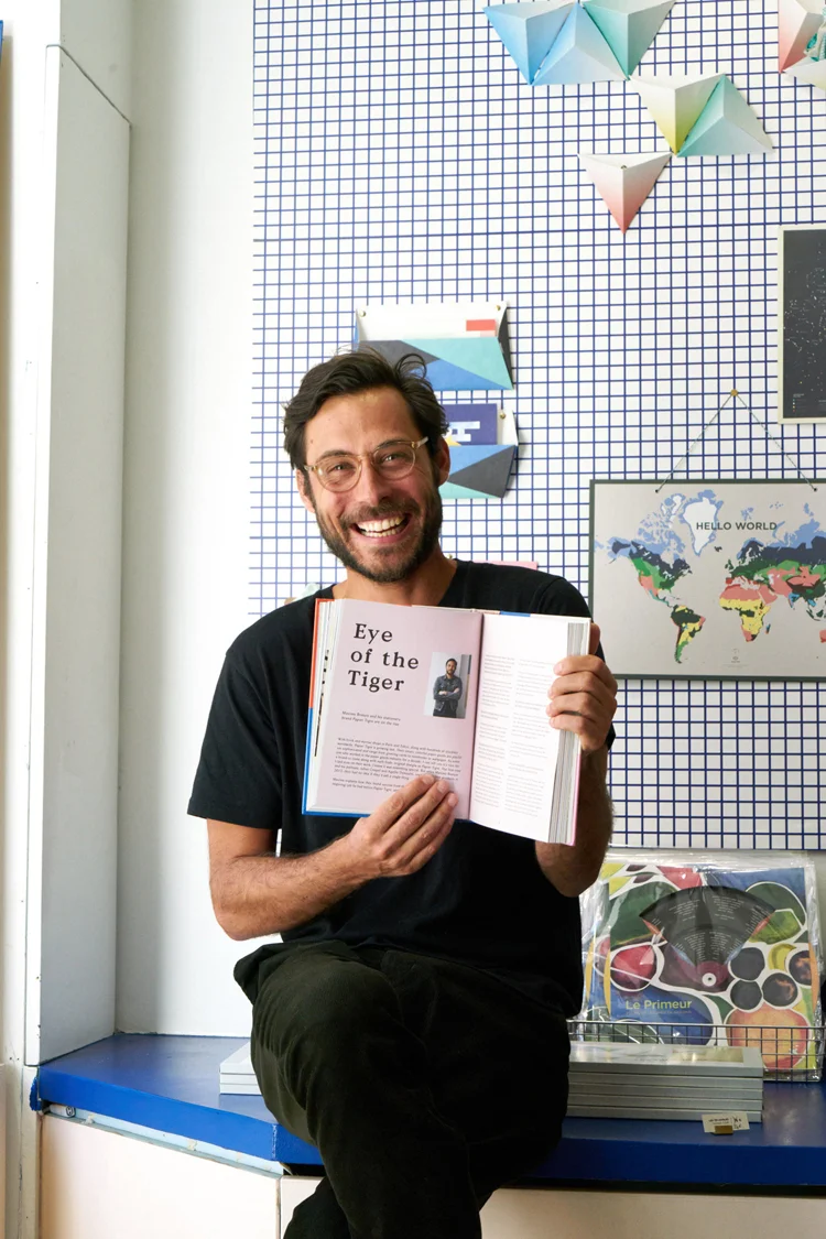 Maxime Brenon, cofounder of Papier Tigre, who appears in the book.