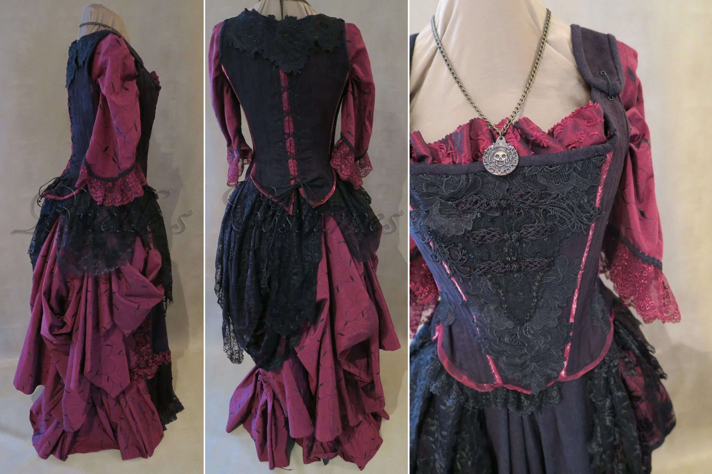 The skirt is a slightly bustle shape with layers of black lace and deep red embroidered fabric.