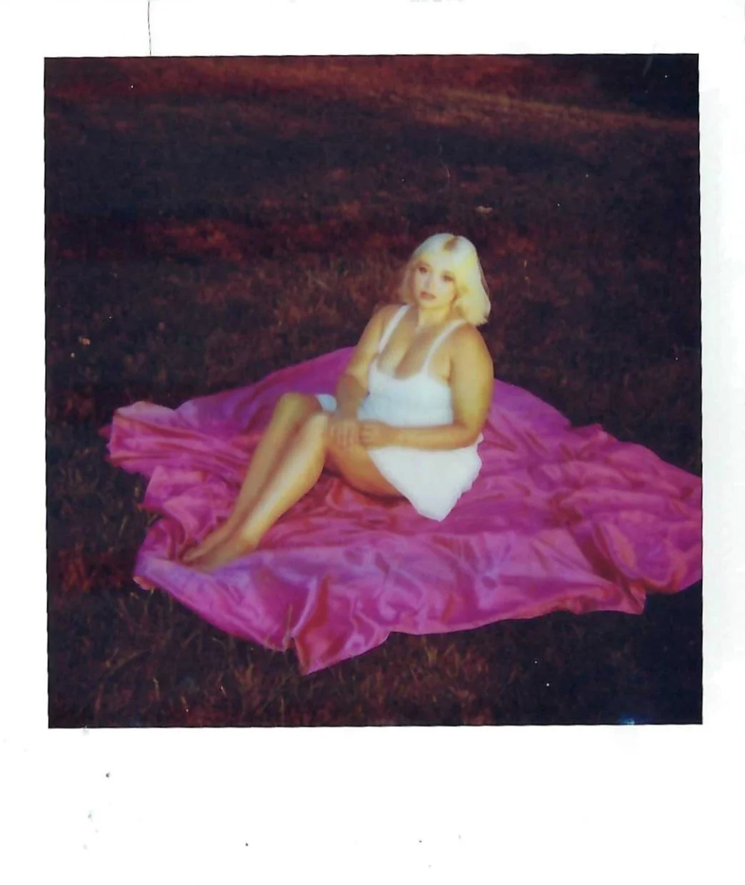 dallas model posing during golden hour for a polaroid photography session