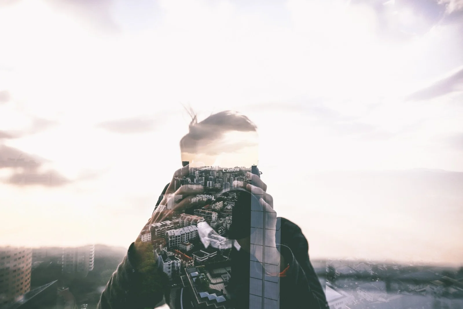man-photographing-city-buildings.jpg