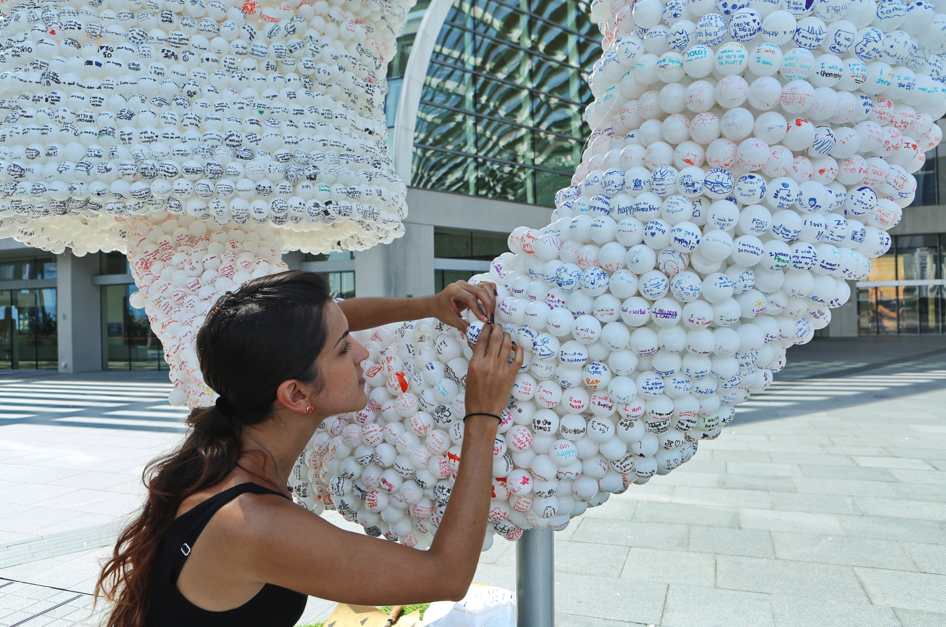 Ouroboros (Nicola at work installing the sculpture), Nicola Anthony, 2015