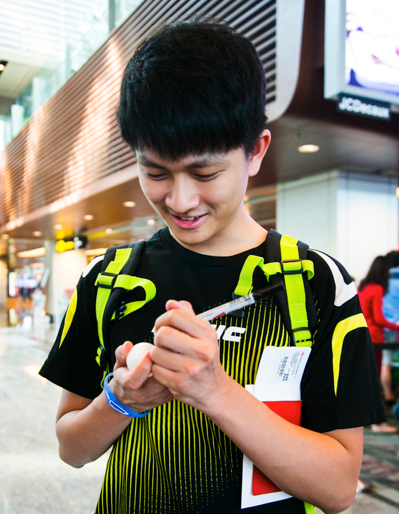 Ouroboros (a member of the Singapore Table Tennis Association writing a message on a ping pong ball), Nicola Anthony, 2015