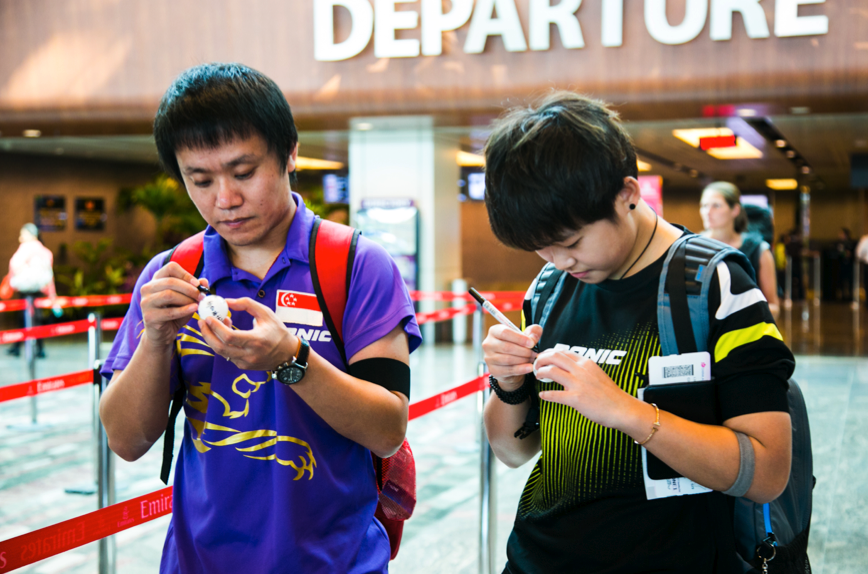 Ouroboros (members of the Singapore Table Tennis Association writing a message on ping pong balls), Nicola Anthony, 2015