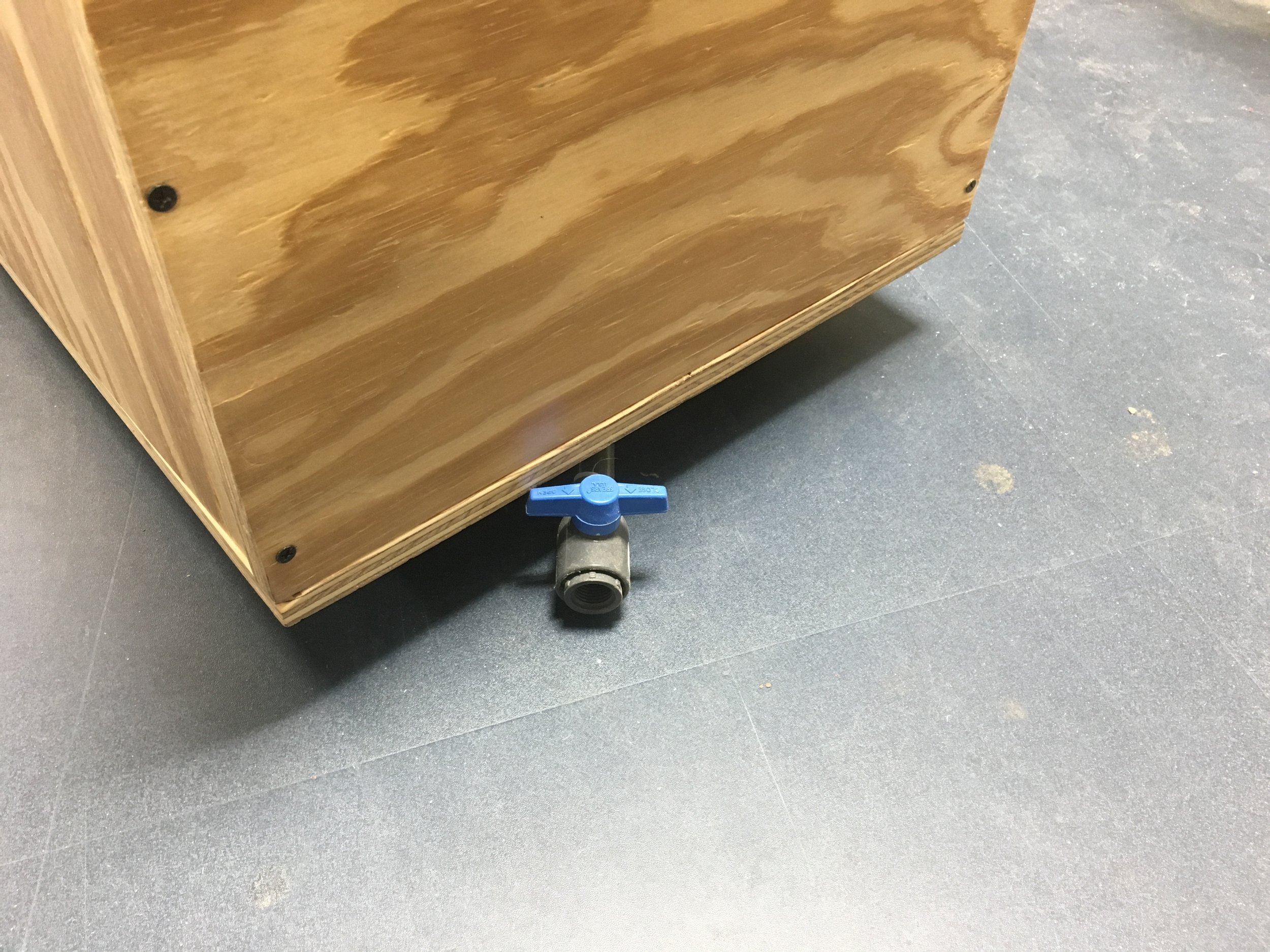 The PVC piping and the ball valve connected to the bulkhead fitting.