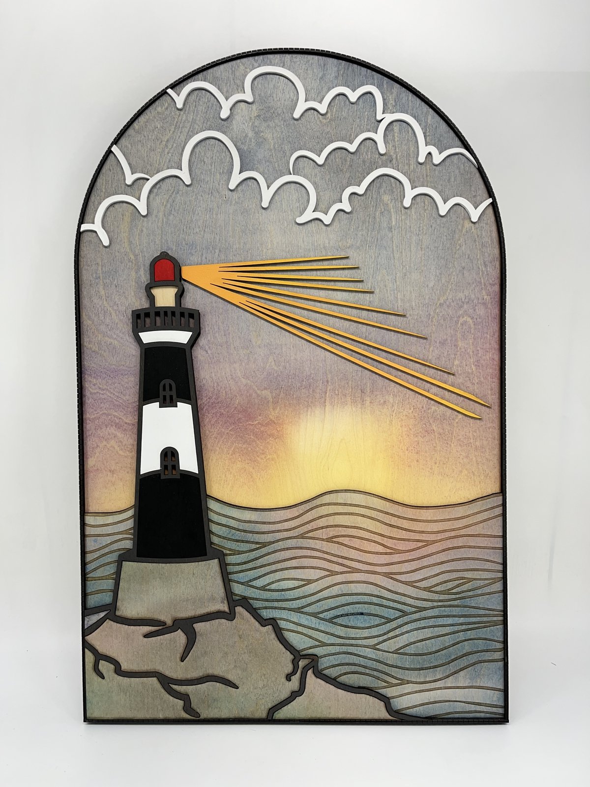 This lighthouse wall art is a special custom piece that we created for the office of a therapist. She requested a lighthouse image that brought some color along with a feeling of peace to the space where she meets with clients. The watercolored wood 