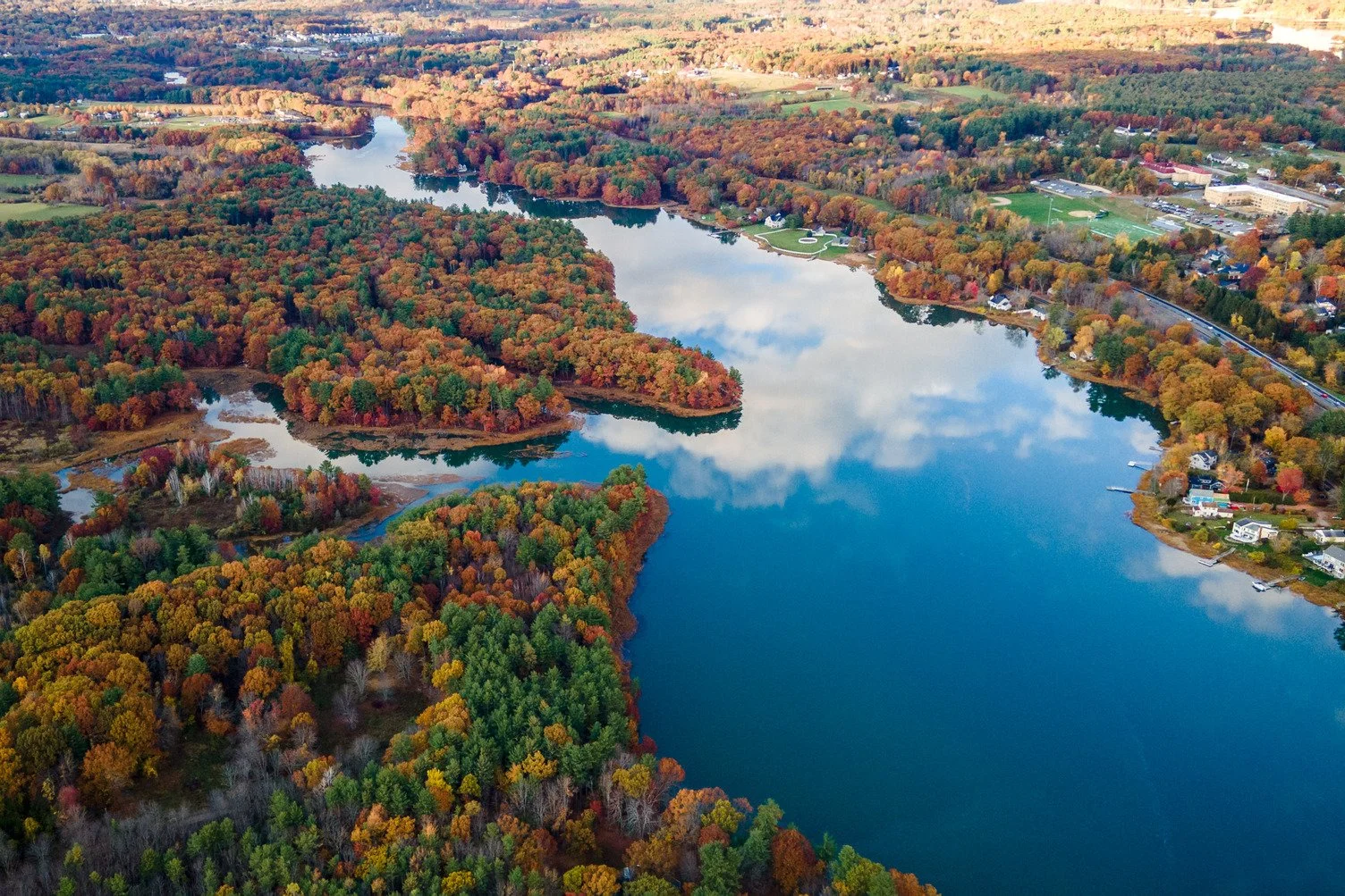 Aerial view of fall foliage surrounding Great Bay near Portsmouth, New Hampshire