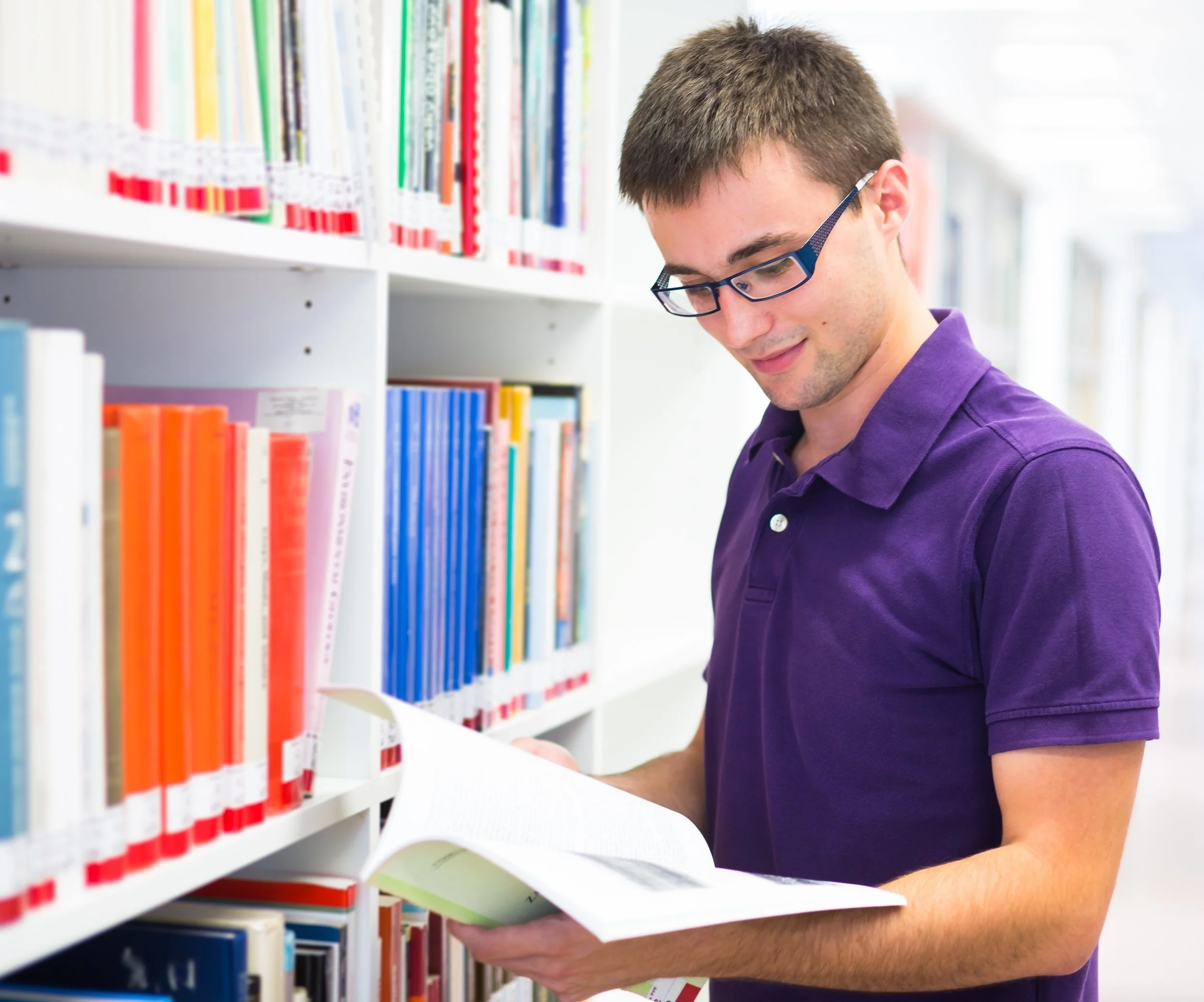  15284236 - handsome college student in library 