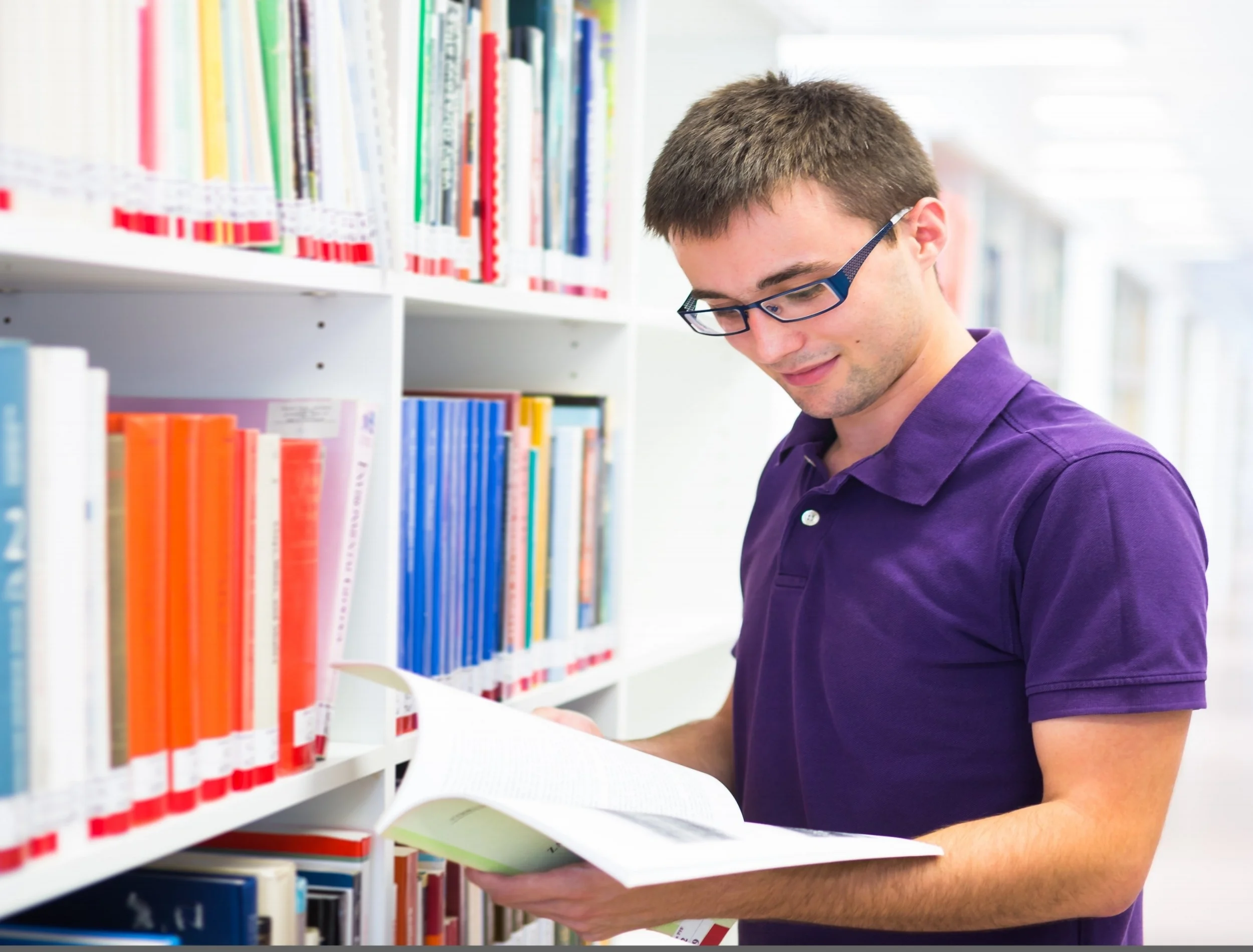  15284236 - handsome college student in library 