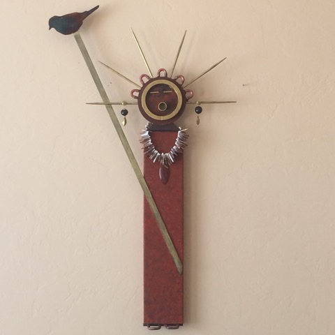 With the bird, she is 23" wide by 37" tall.