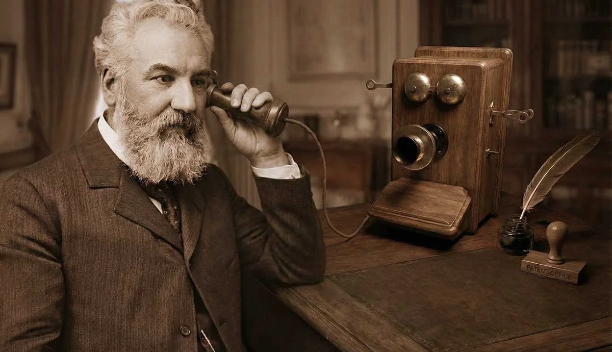 alexander-graham-bell-holding-phone-to-ear.webp