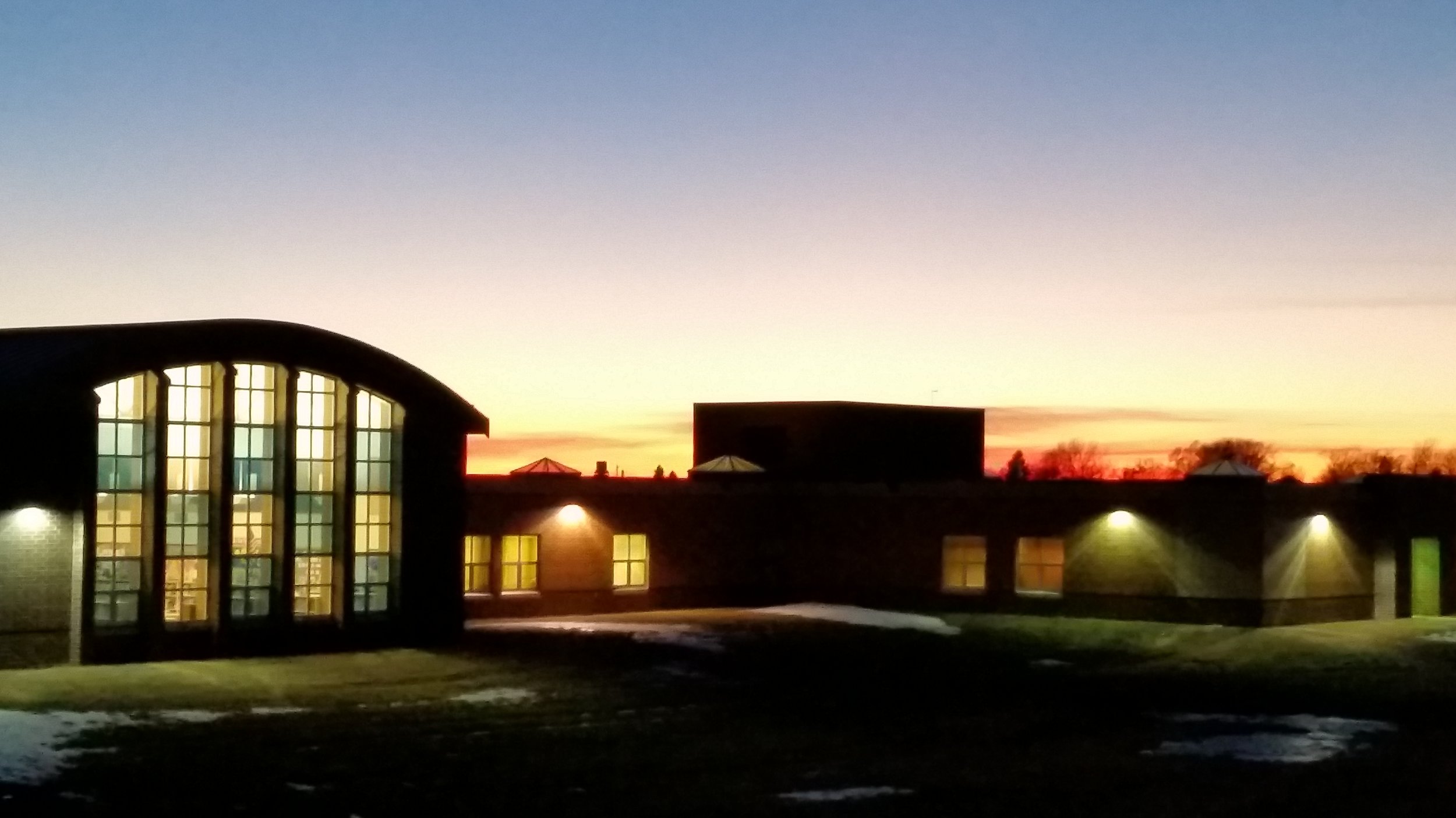  Back perspective of R.F. Pettigrew Elementary at dusk 