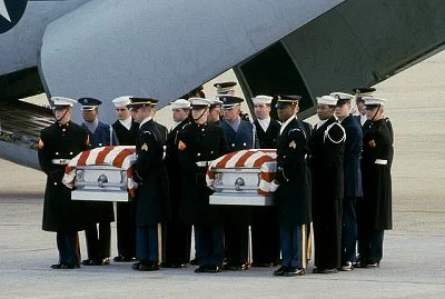 The bodies of Charles Hegna and William Stanford, who were killed by terrorists aboard an Iranian airliner, arrive home at Andrews Air Force Base in 1984. (Credit: Corbis)