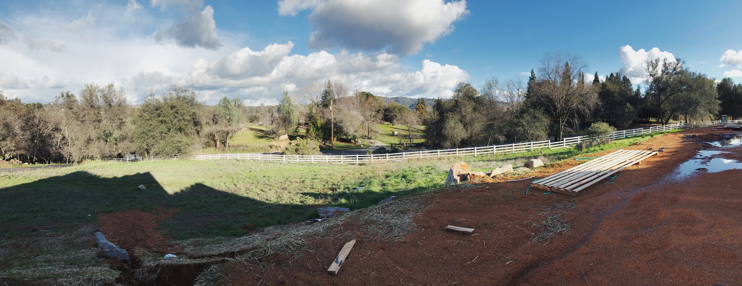 View from what will be the front porch. Planning on some grape vines in the front and a fish pond in the lower left section of the front yard (what’s a word for something much bigger than a yard?).