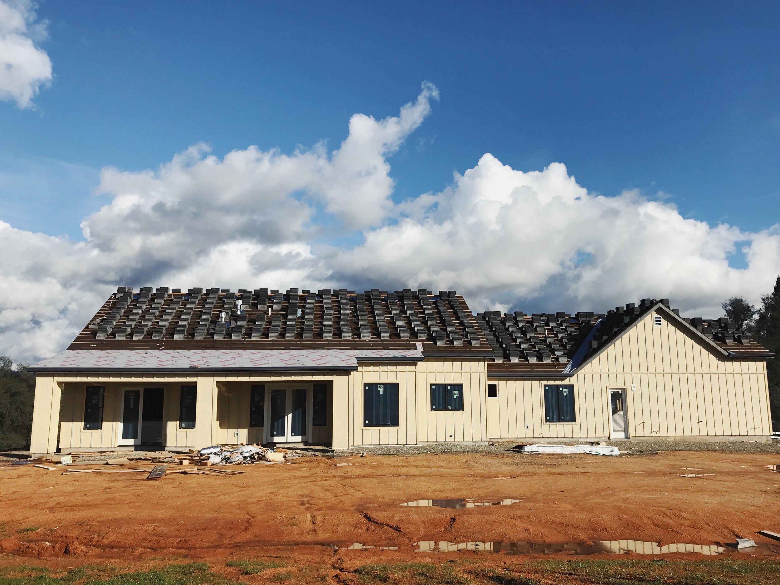 Rear elevation. I LOVE that the back of the home faces the setting sun. A pool will be here eventually.