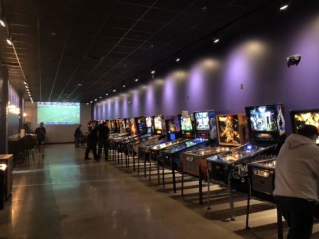 The new Pinball machines in MOM’s Organic Market in College Park are drawing gaming lovers from all over the area. (Photo courtesy of Ndeye Aminata Ndiaye)