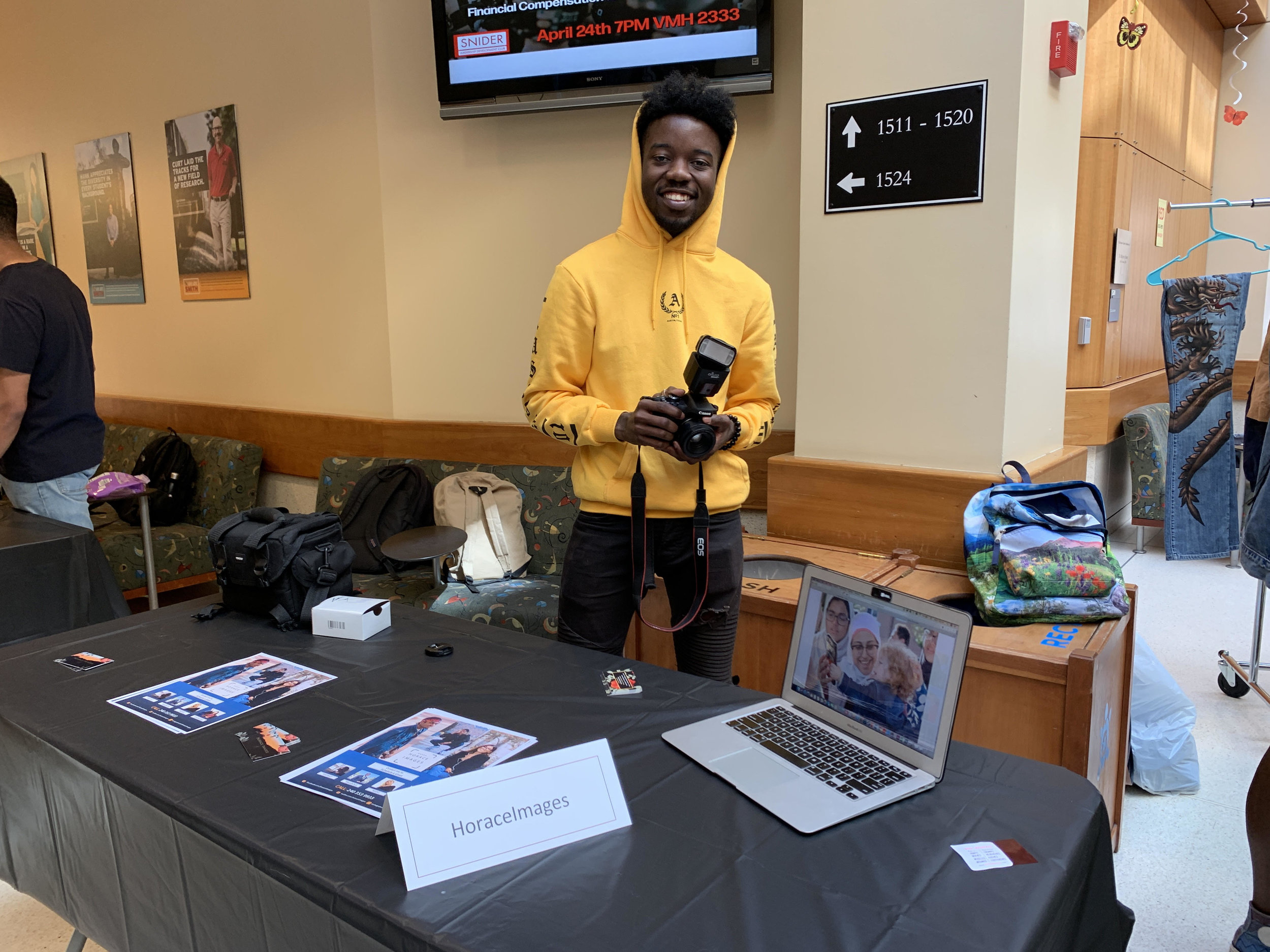 Chris Wright, a senior communications major, poses with his table at the Terp Marketplace on Wednesday, April 10 in the Pownall Atrium in Van Munching Hall.