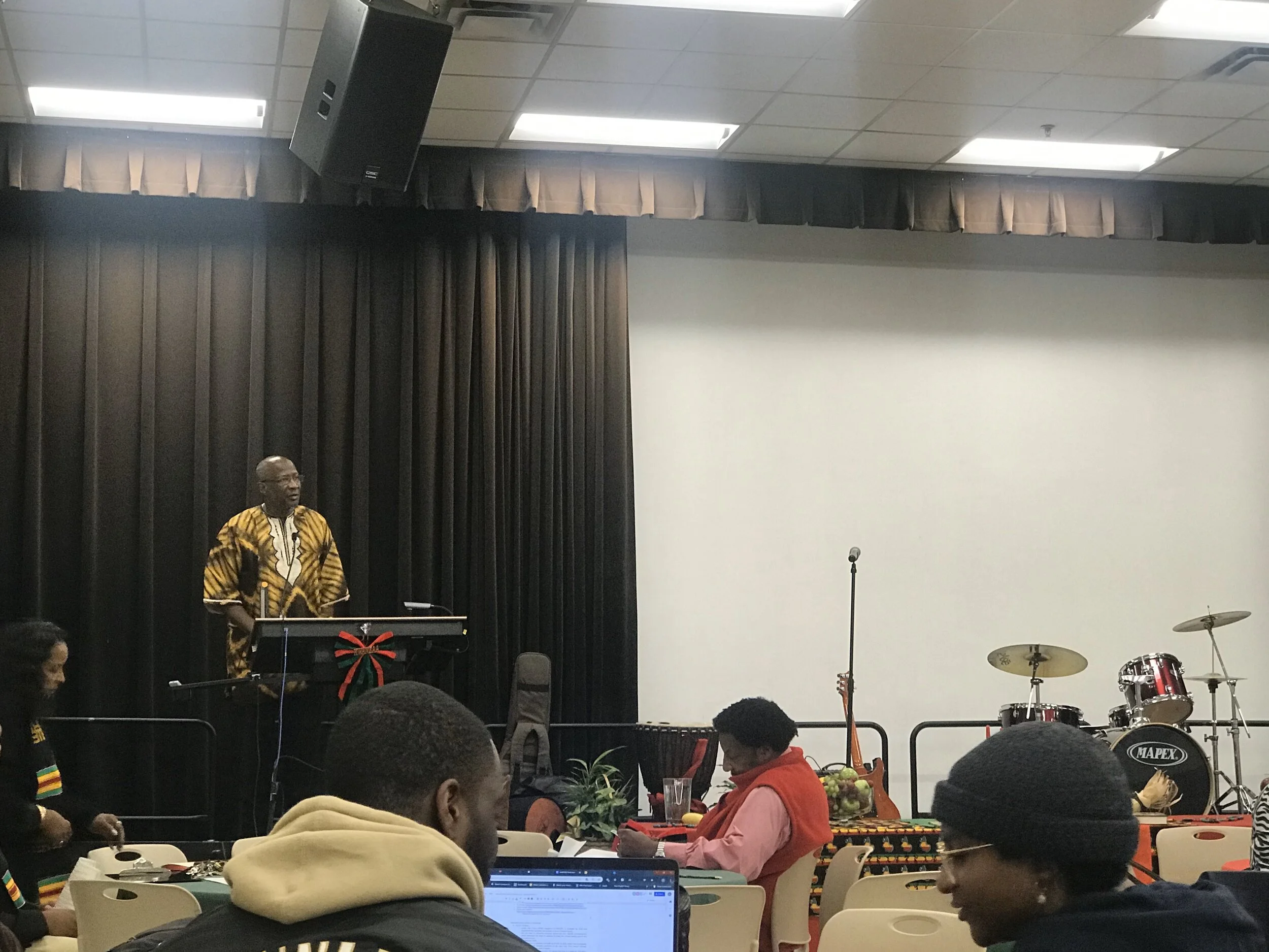  Nyumburu Director, Dr. Ronald Zeigler welcoming students and faculty to the Kwanzaa celebration. (Zamir Courtney/The Black Explosion) 