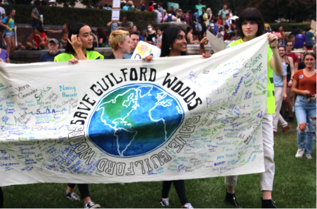 Students gather to protest housing project set to demolish Guilford Woods