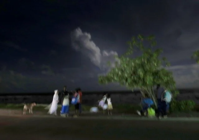 1. Waiting by the shore for a lift home after a child's birthday party in a shipping container.jpeg