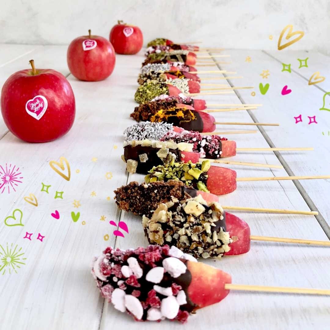 #TasteTheWow ⁣
⁣
Fresh Pink Lady&reg; Apple lollipops, drizzled in dark chocolate and topped with your choice of seeds, nuts, and dried fruit &ndash; YUM! ⁣
⁣
Not only are these tasty morsels a great way to encourage children to eat more fruit these 