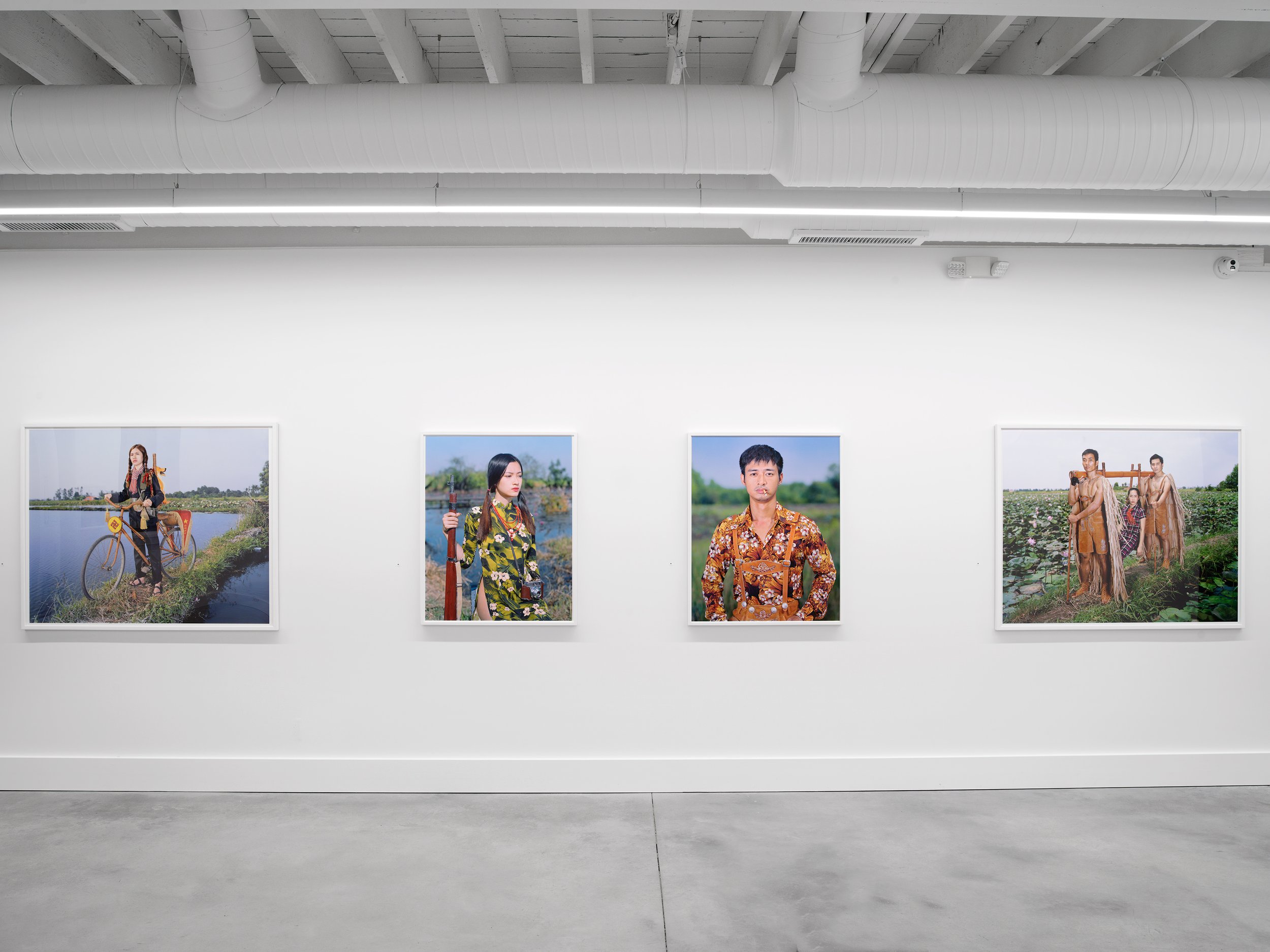  Installation view of Olivier Laude:    Chiến Thắng Ba Tơ  left to right:  Chiến Thắng Ba Tơ, Sis{Quynh}, Linh, Cáng  
