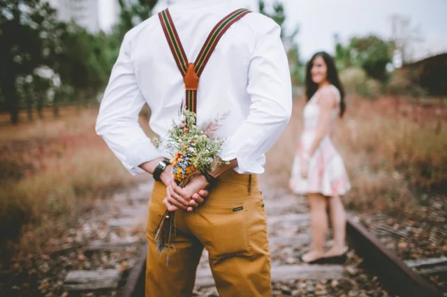 pexels-photo-236287 - man w flowers on RR Track.jpeg