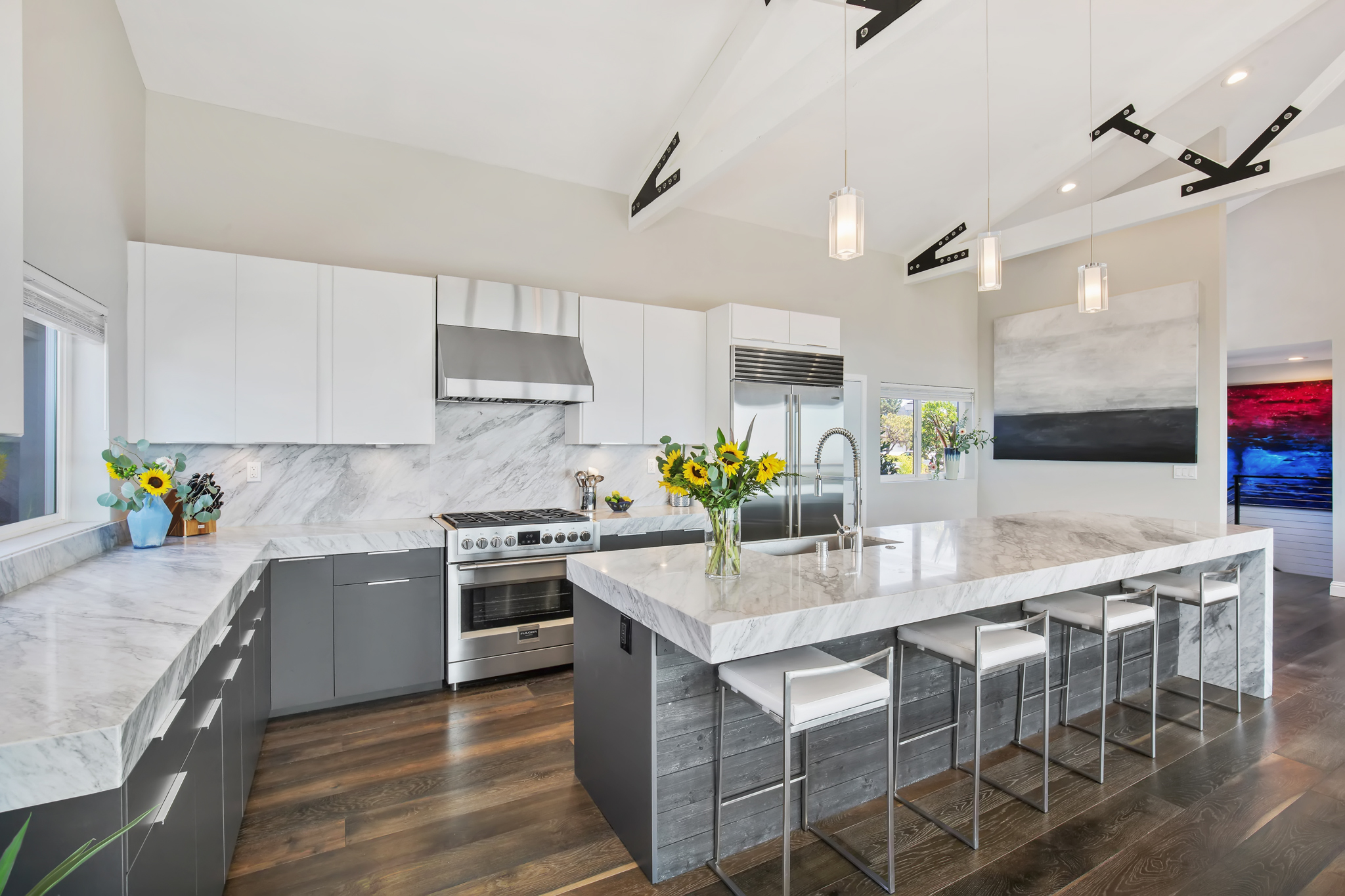 A Chef’s dream kitchen, 12’ Calacatta Marble Island, Luxe Cabinets with Fulgor Milano Range, Zephyr Hood, Subzero Refrigerator and Miele Dishwasher.