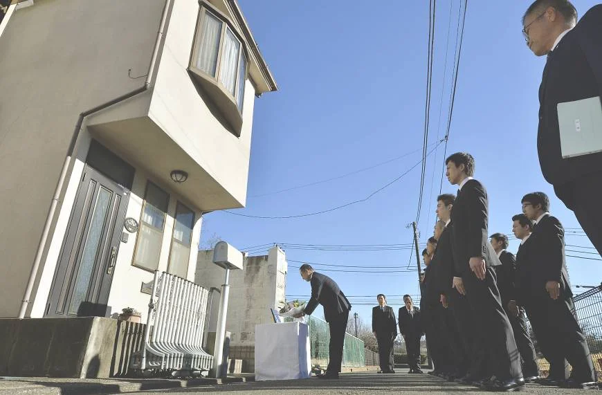 Police paying their respects to the Miyazawa family at their home, years later