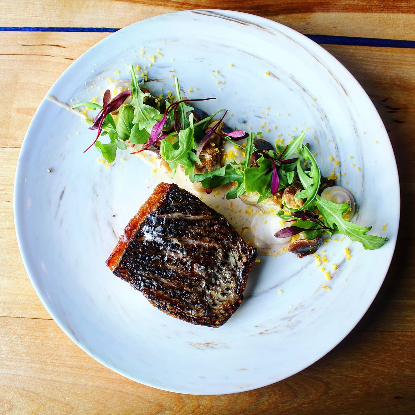 Striped sea bass with roasted mushrooms, white bean puree, arugula, saffron aioli, and cured egg yolk. We can't resist the 🐟 lately. Call soon to hook a reservation for the weekend.
.
.
.
.
.
.
.
.
.
.
.
.

#eatlocal #farmtotable #eatmaine #travelma