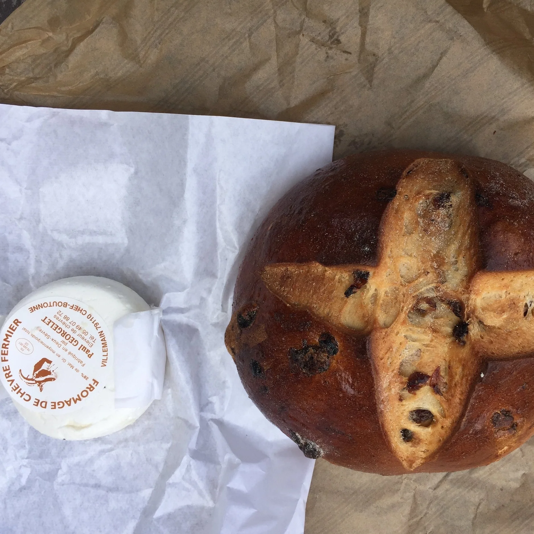 Healthy snack @&nbsp;Clisson outdoor market - fresh goat cheese and raisin countryside bread.