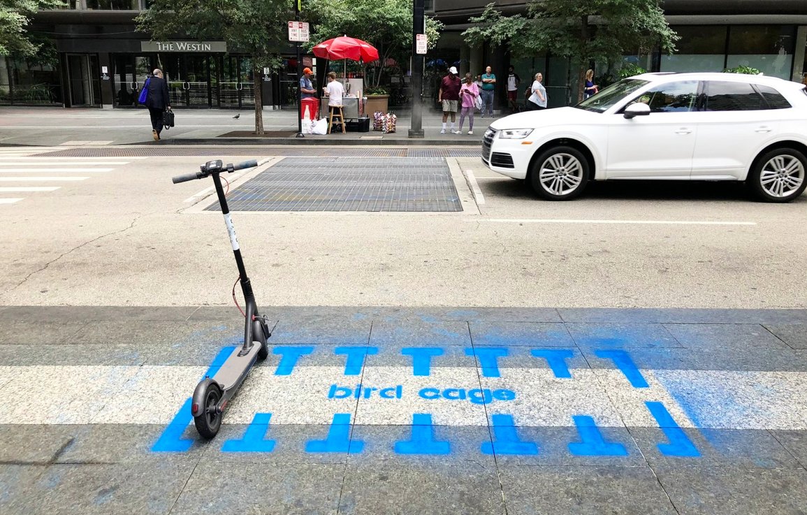 A group of tactical urbanists installed "Bird Cages" last week in public spaces around downtown Cincinnati in order to spur some creative thinking about how cities can adapt to the dockless scooters fad instead of outright ban them. (photo via Yard & Company )