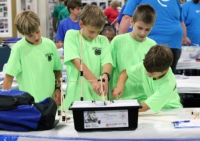 4-H students from Caldwell County work on a project as part of the Science and Technology day held at Cloverville during the recent Kentucky State Fair.